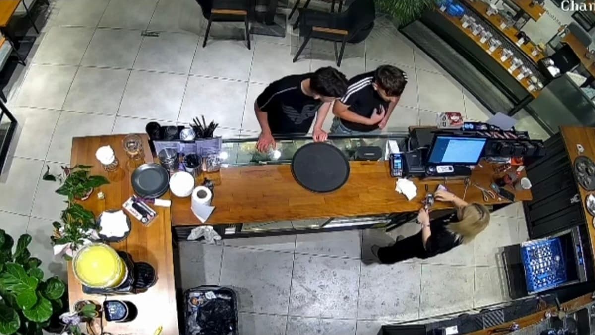 Barista S.Y. behind the counter of the Avcılar café, moments before the confrontation, from CCTV footage published by Turkish outlets