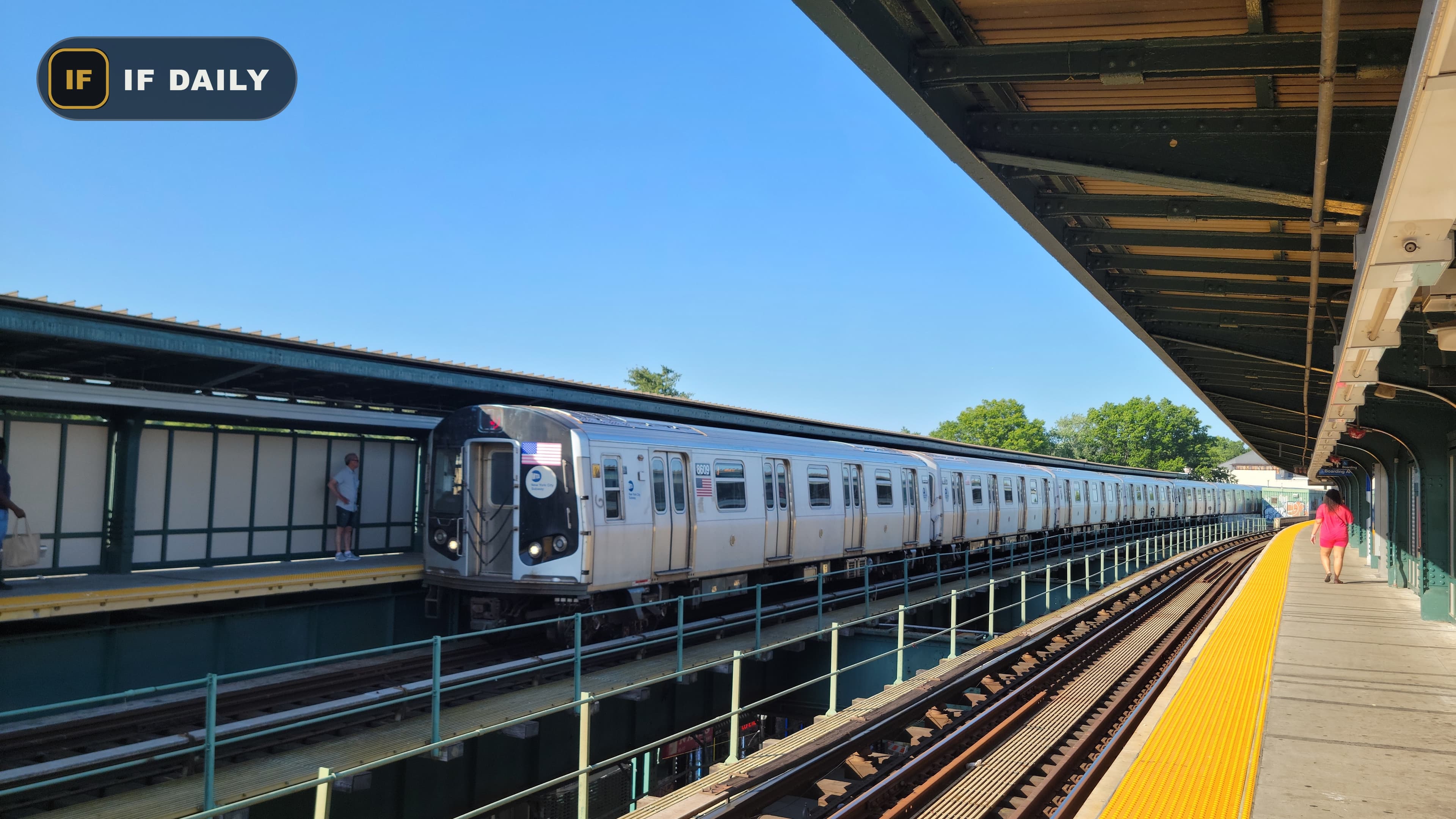 A J train arriving at the Woodhaven Boulevard station platform in Queens