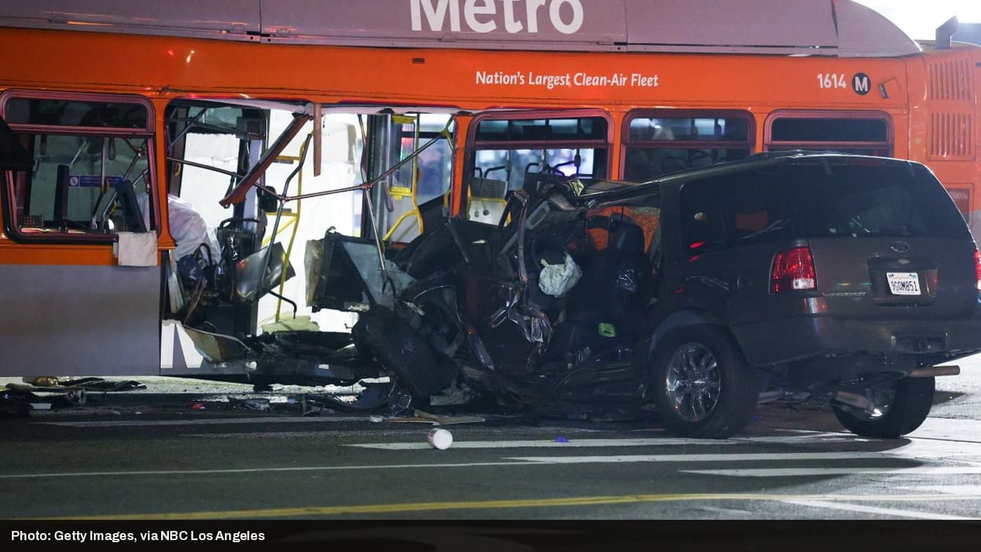 A dark SUV is lodged into the side of a Los Angeles Metro bus after a collision in Chatsworth.
