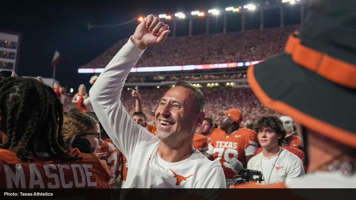 Texas head coach Steve Sarkisian celebrates with players and fans after the comeback win over Ohio State.