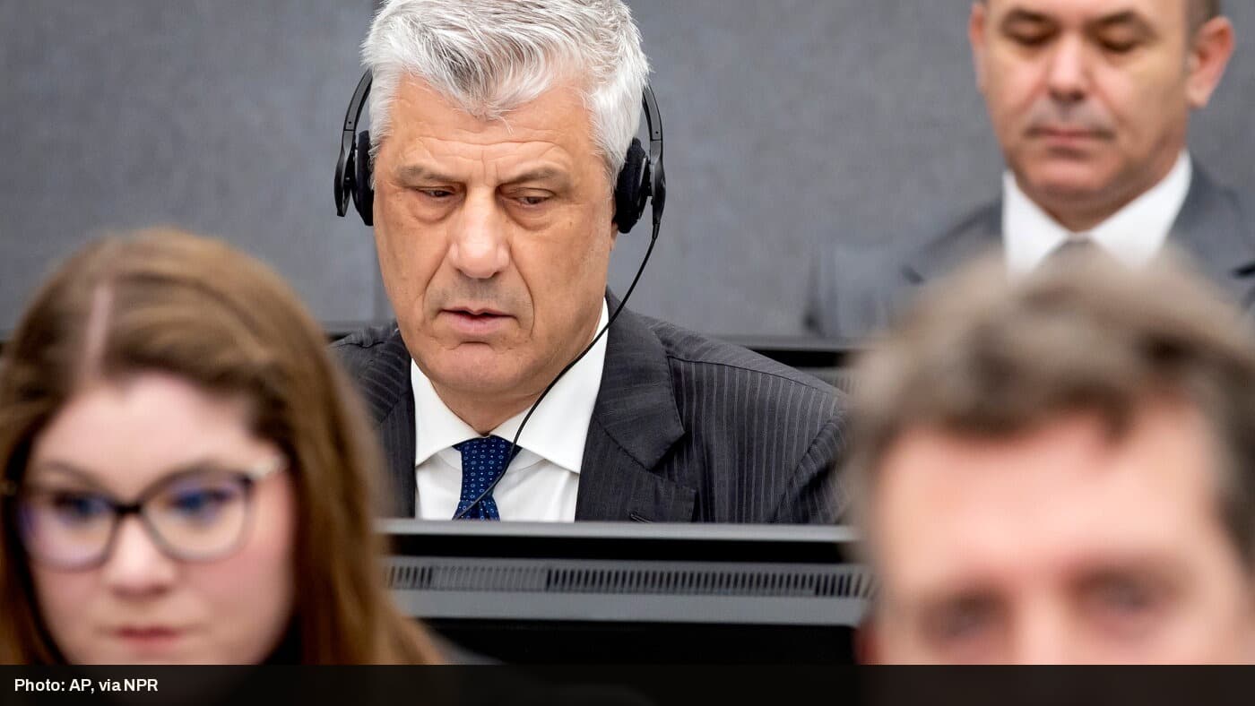 Former Kosovo President Hashim Thaçi wears headphones in the courtroom at the Kosovo Specialist Chambers.
