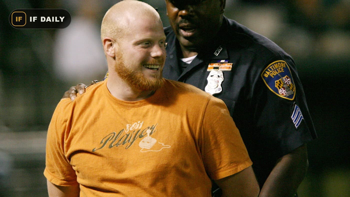 A Baltimore Police officer arresting a man