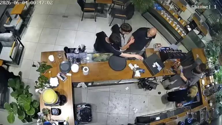 CCTV footage timestamped 2026-06-04 showing the confrontation at the café counter in Avcılar, Istanbul