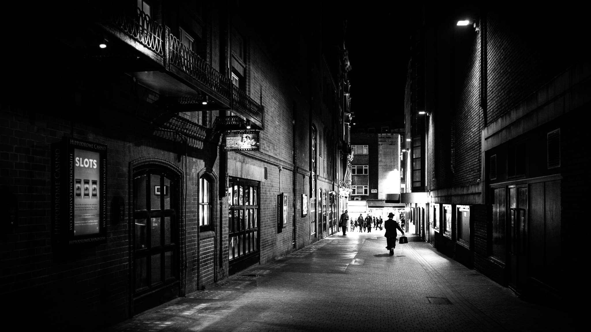 A dimly lit street at night in London (generic file photo, unrelated to the hoax images described)