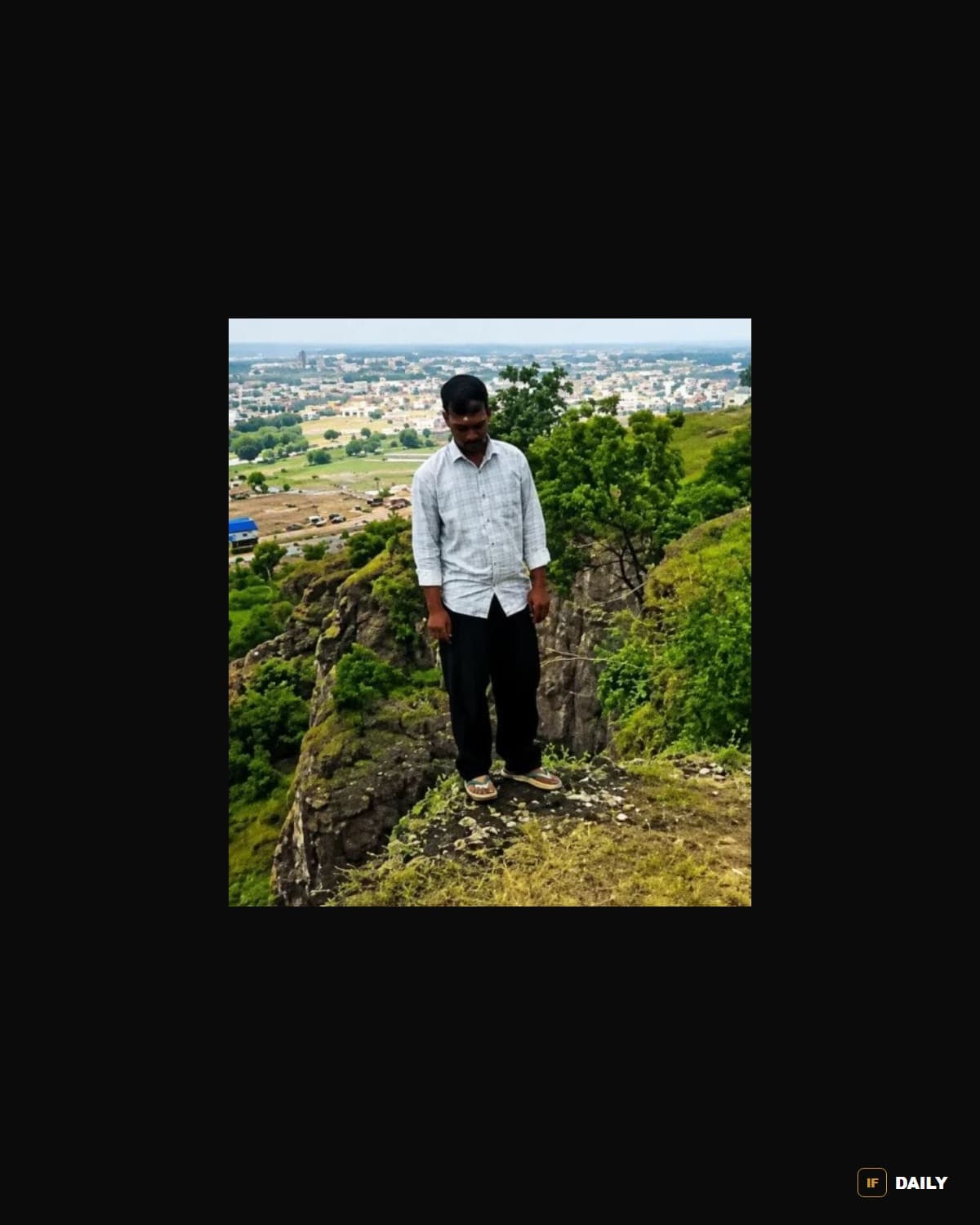 A man stands near the edge of Khavdya Hill overlooking Chhatrapati Sambhajinagar, in a photo that has circulated widely in Indian news coverage of the incident