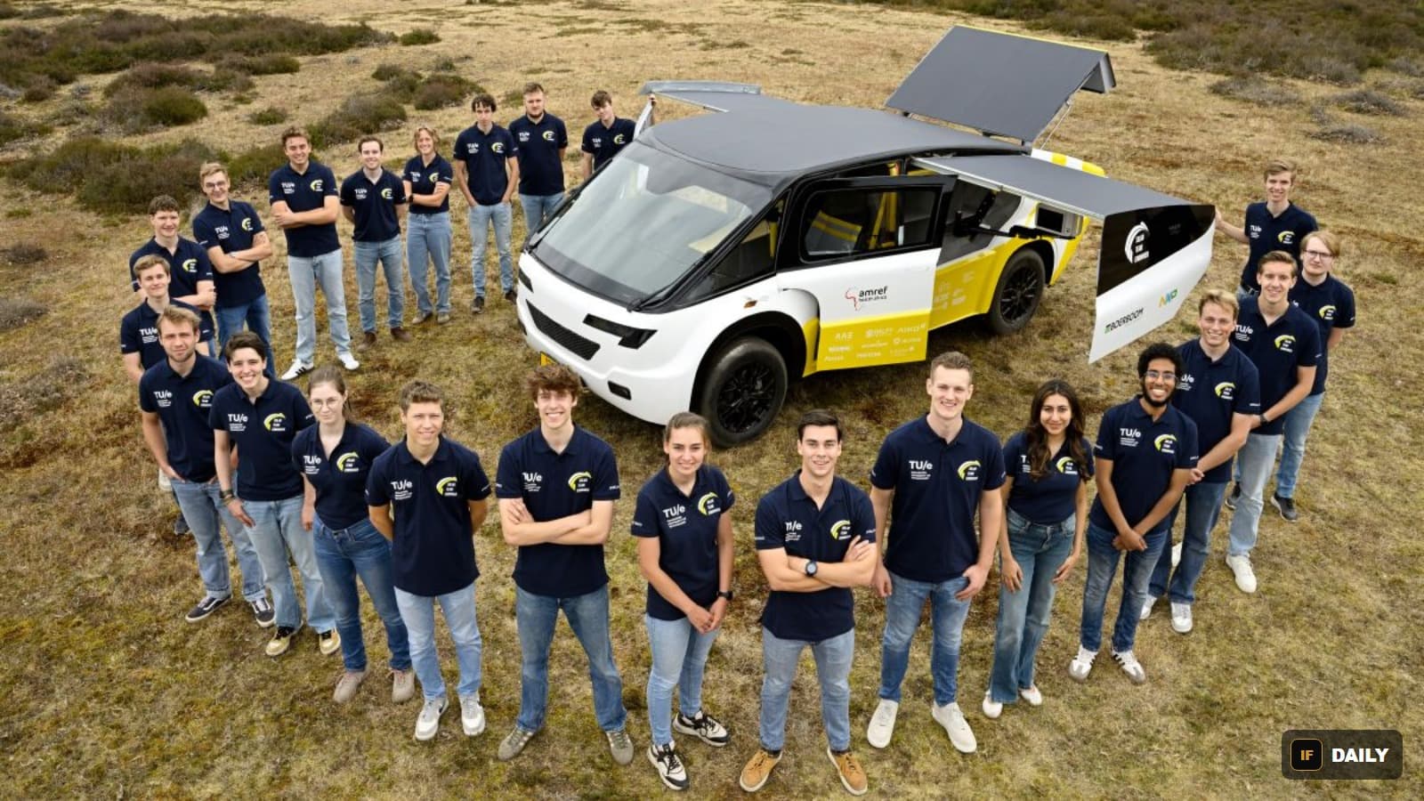Solar Team Eindhoven, 23 students, standing with their solar-powered ambulance vehicle Stella Juva