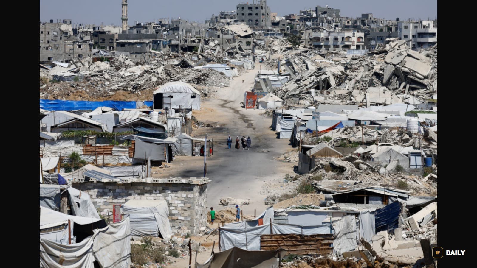 An aerial view of a displacement camp of tents built into the rubble of destroyed buildings in Gaza