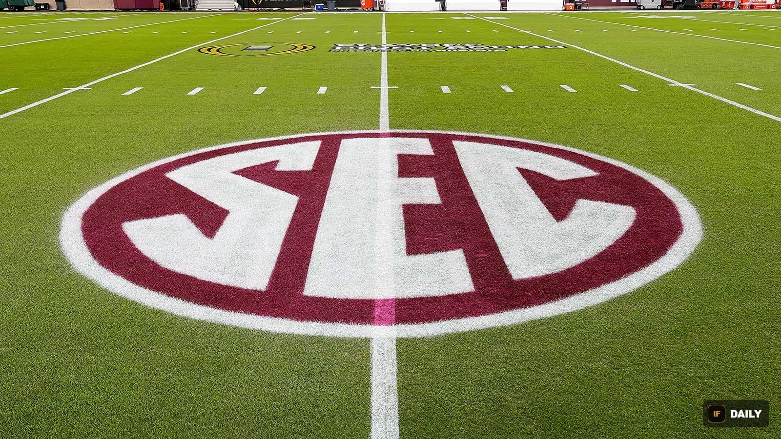 The SEC logo painted at midfield on a football field