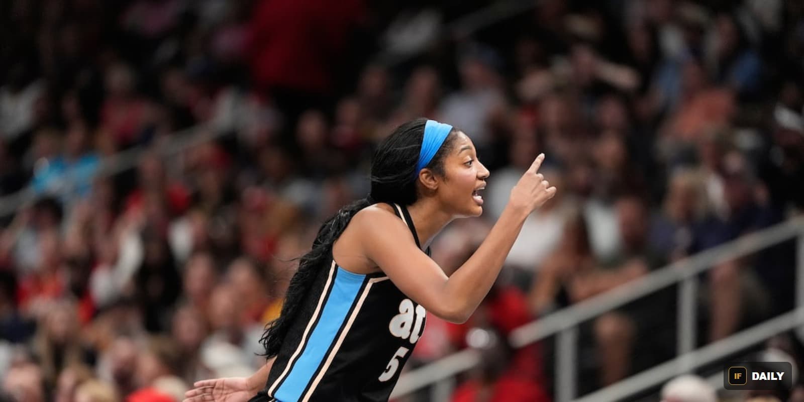 Angel Reese pointing and shouting on the court during a game
