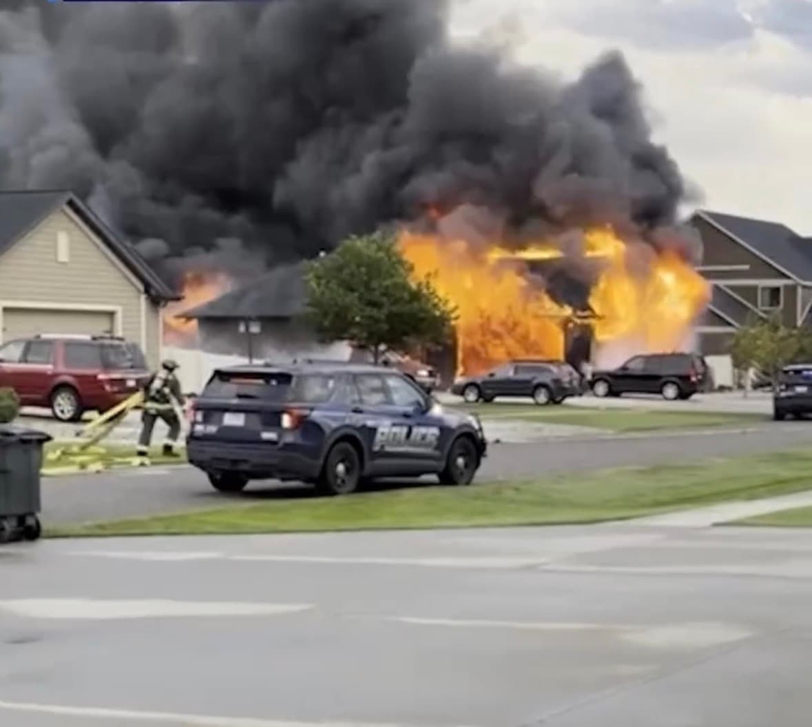 Police and investigators at the scene of a house fire in Billings, Montana, where eight family members were killed