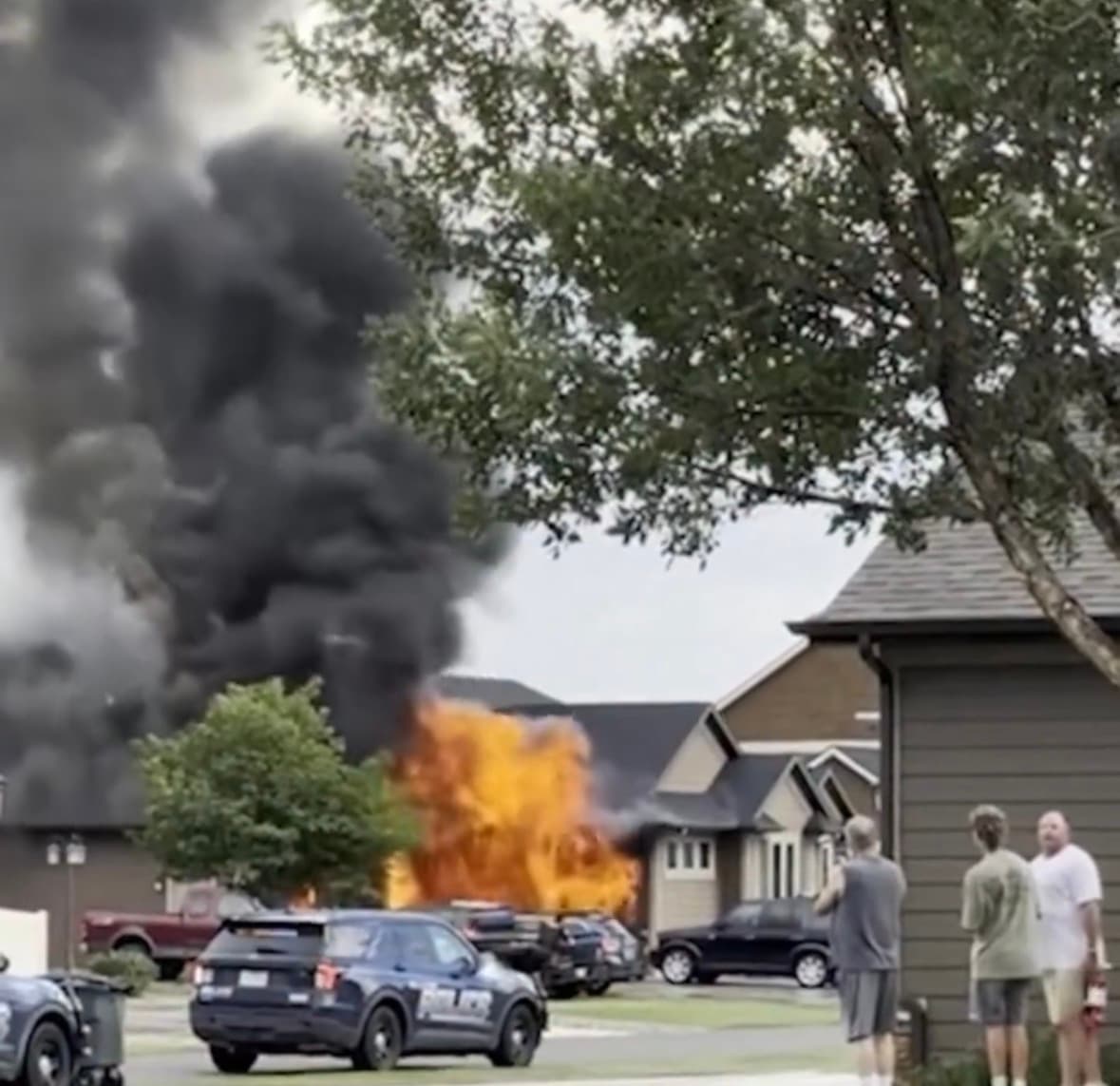 Police and investigators at the scene of a house fire in Billings, Montana, where eight family members were killed