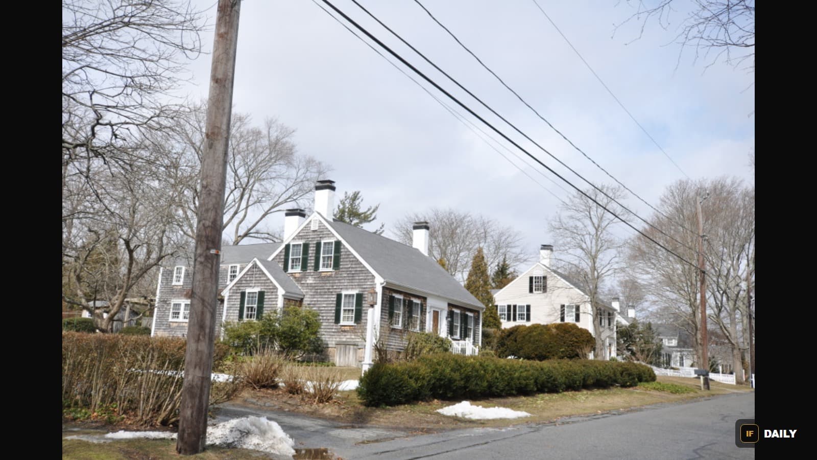 A quiet residential street in Duxbury, Massachusetts lined with historic colonial homes