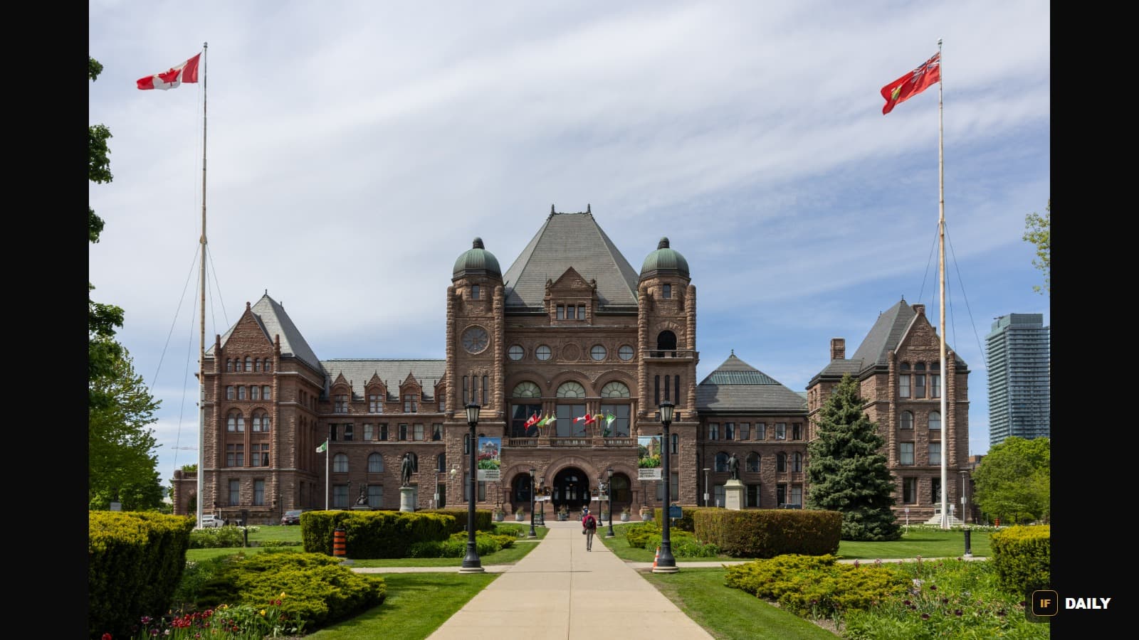 The Ontario Legislative Building at Queen's Park in Toronto, with Canadian and Ontario flags flying