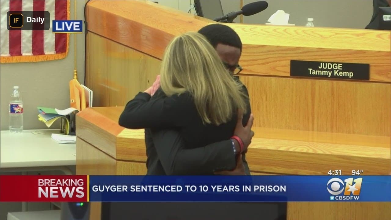 Brandt Jean embraces Amber Guyger in a Dallas courtroom moments after her sentencing, as broadcast live on CBS 11