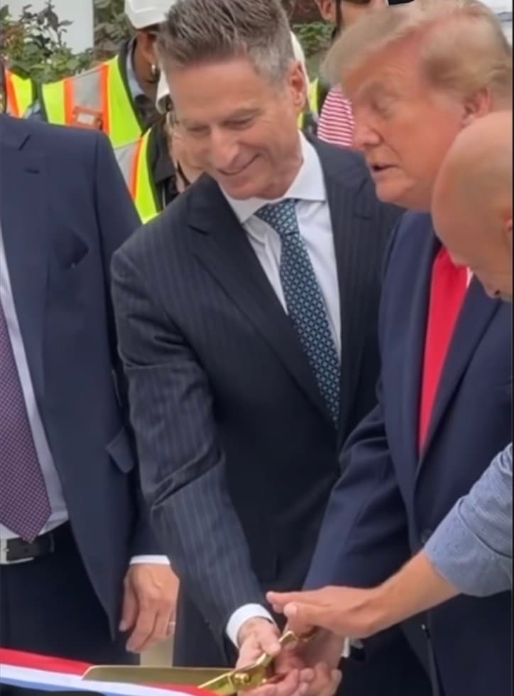 Donald Trump cuts the ribbon to officially open the new White House helipad