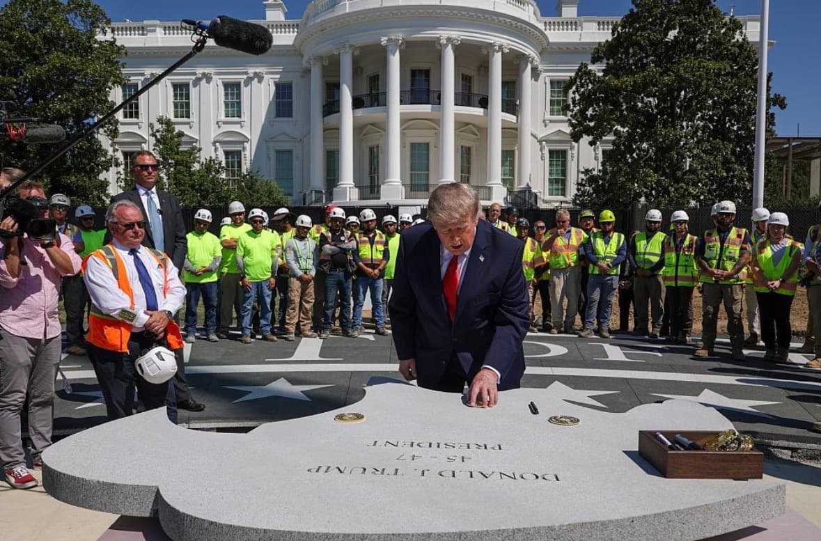 President Donald Trump cuts the ribbon to officially open the new White House helipad on September 21, 2026. Photo: The White House.