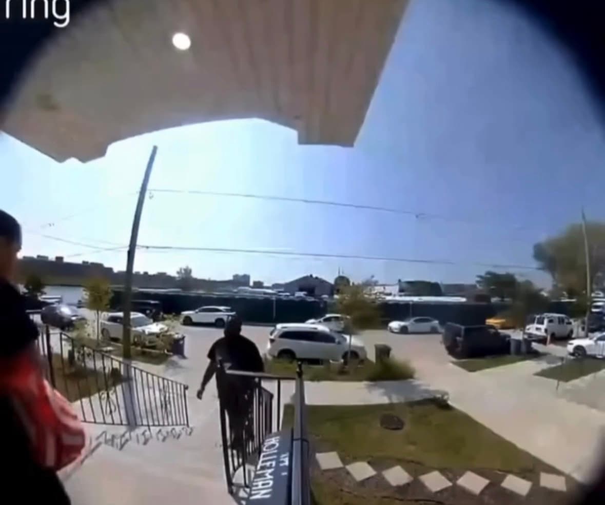 Surveillance footage shows a woman arriving at a destination while a man walks behind her