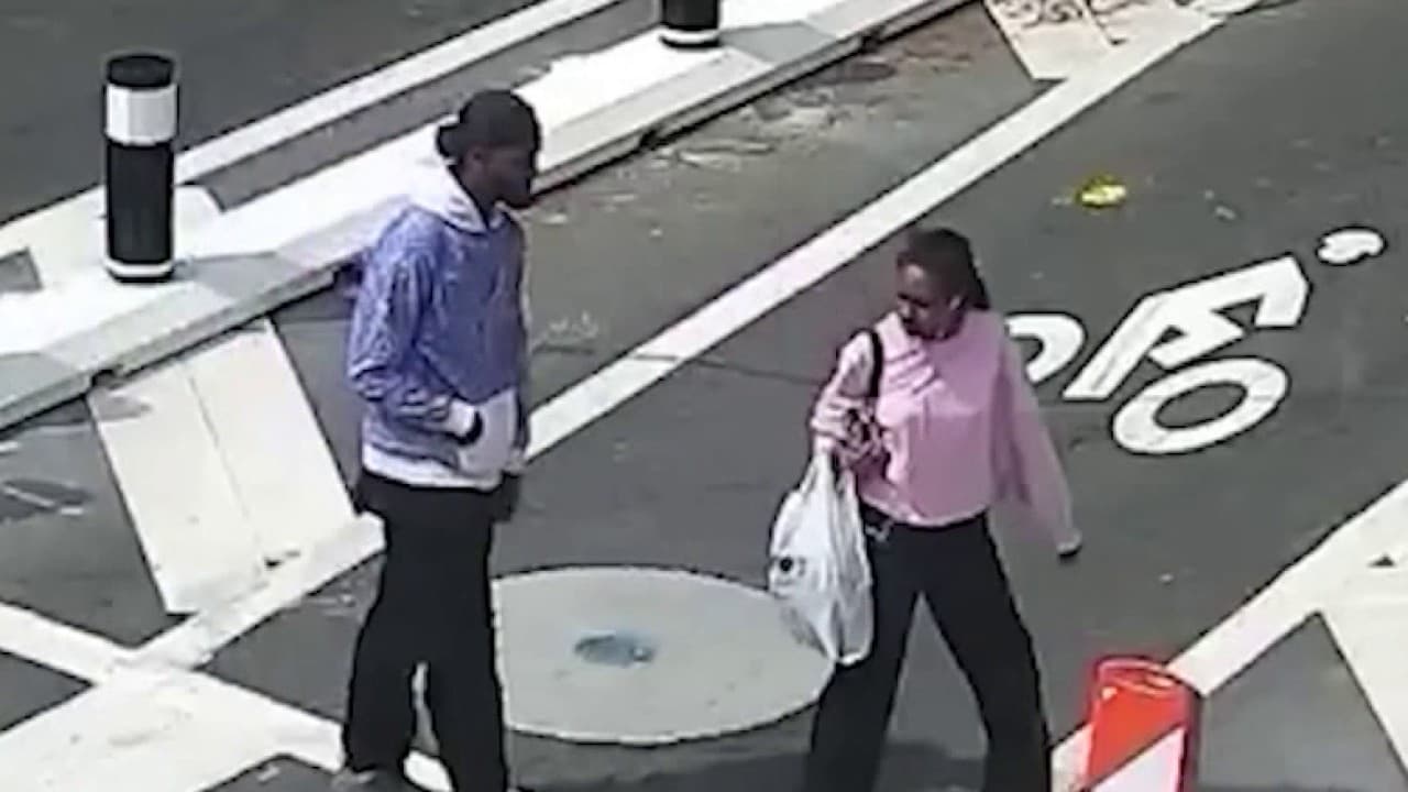 Surveillance footage shows a robbery suspect following a woman through an Atlanta crosswalk before an alleged attack.