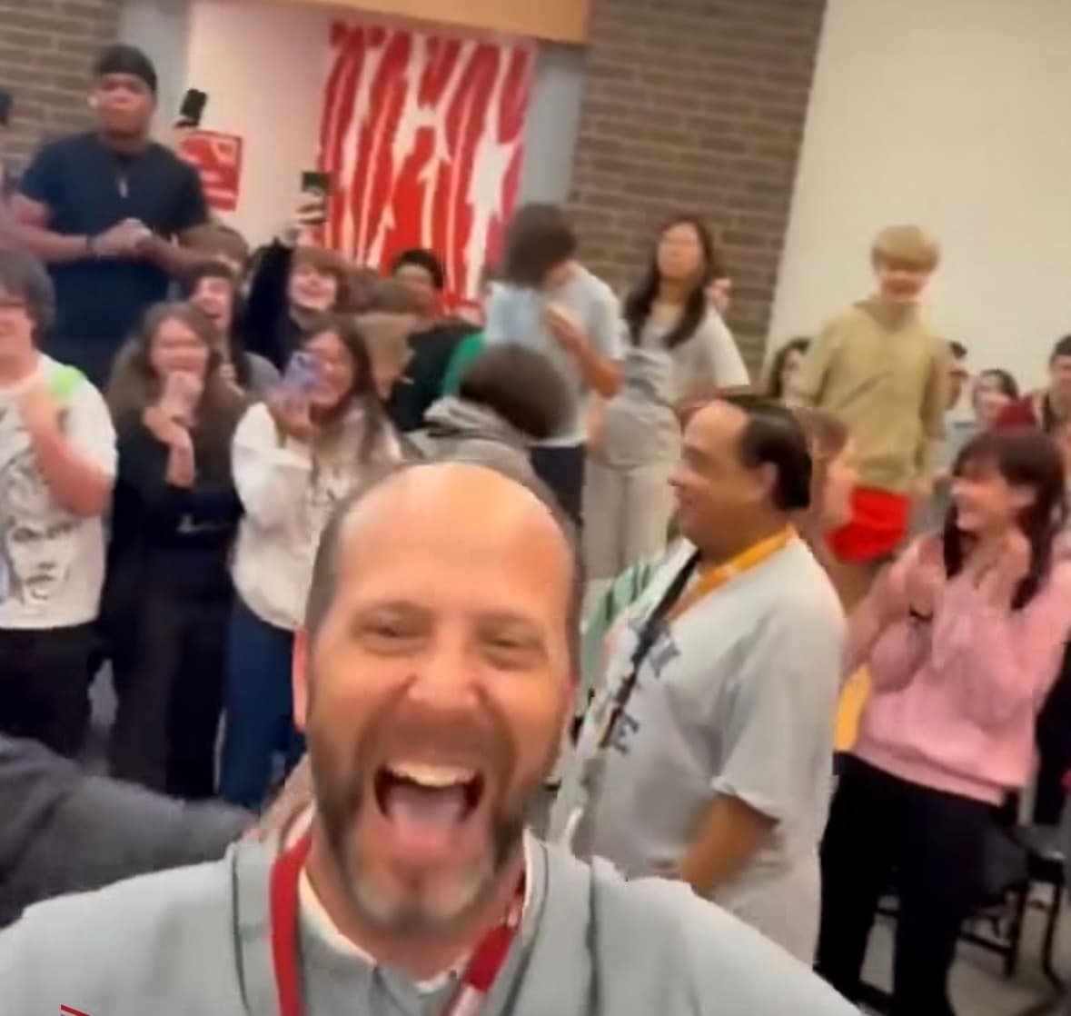 Teacher Joshua Filiatrault reacts to a surprise birthday celebration organised by his students at Johnston Heights Secondary School in Surrey, Canada.